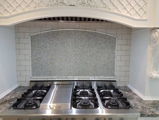 Kitchen backsplash and range with new tile